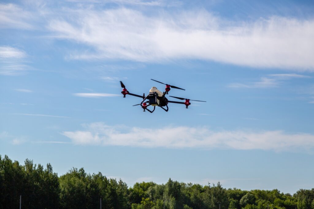Agriculture drone fly to sprayed fertilizer on the fields. Industrial agriculture and smart farming